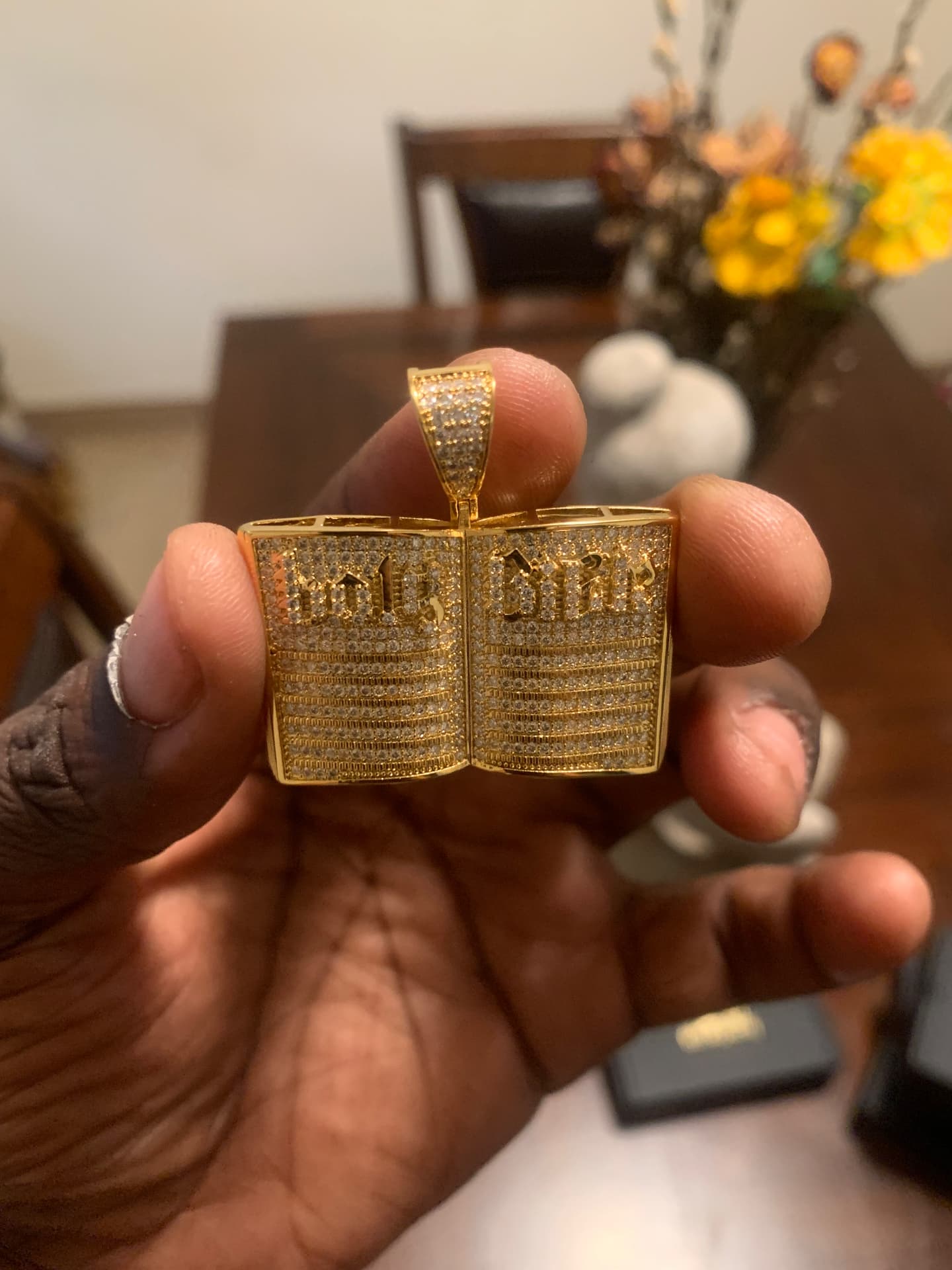 Close view of the iced Holy Bible pendant