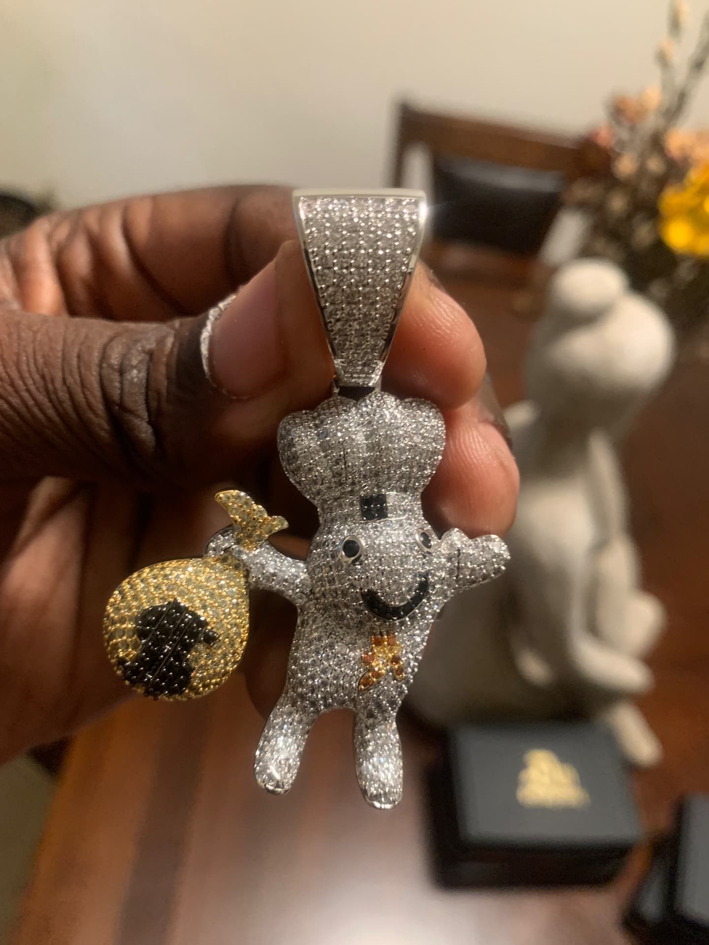 Close view of the iced money chef pendant