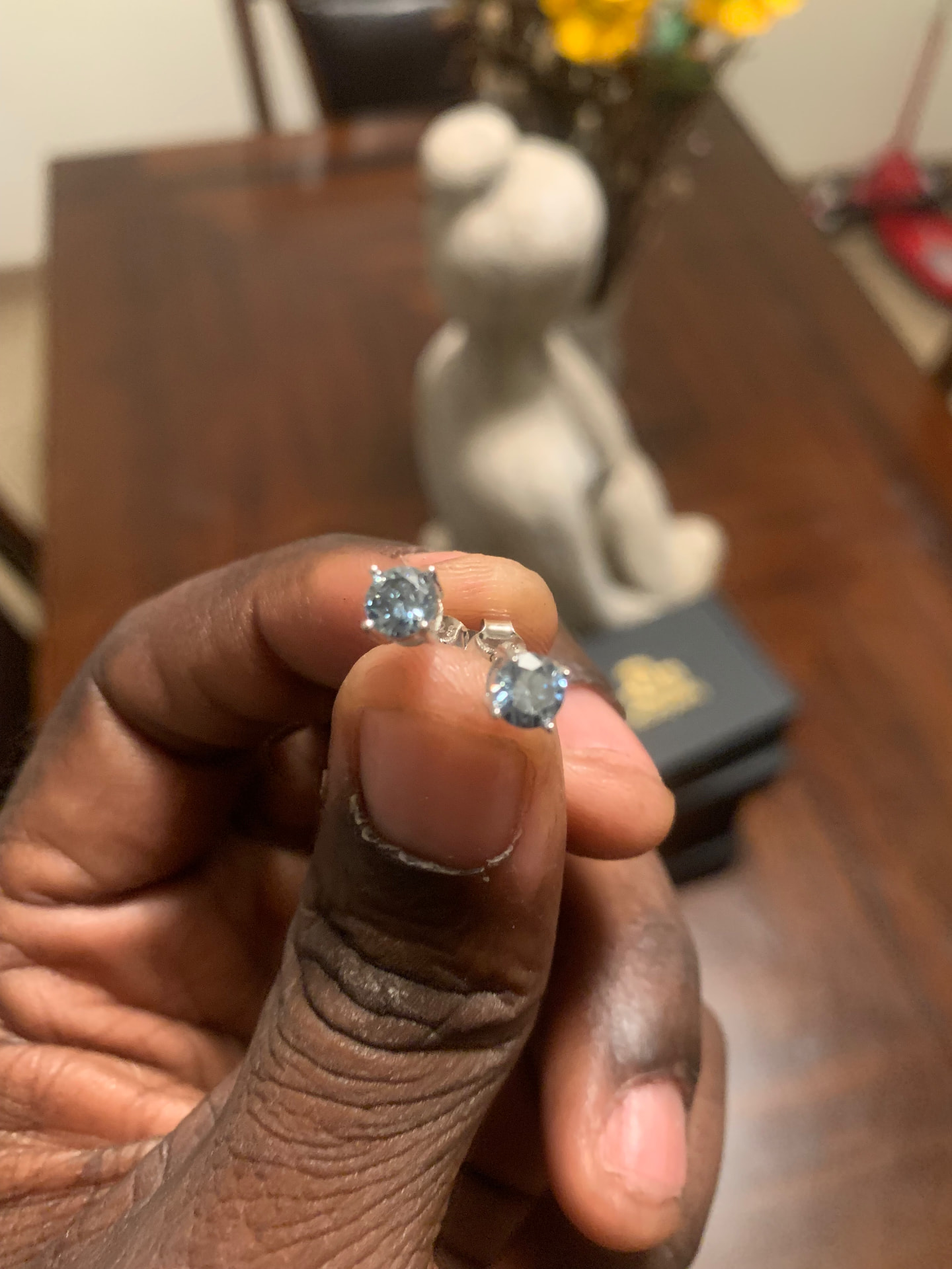 Pair of round moissanite solitaire stud earrings