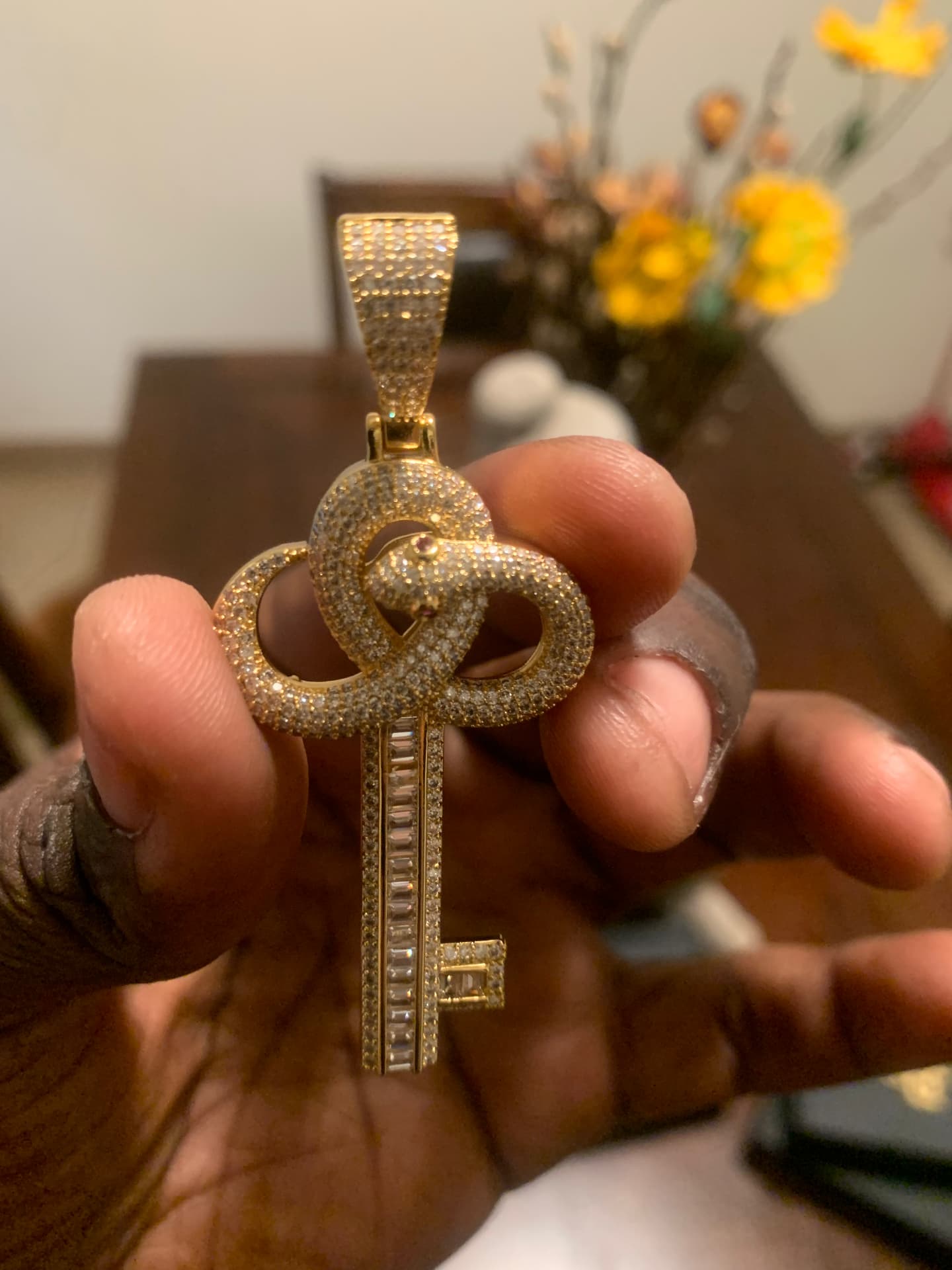 Close view of the moissanite snake key pendant