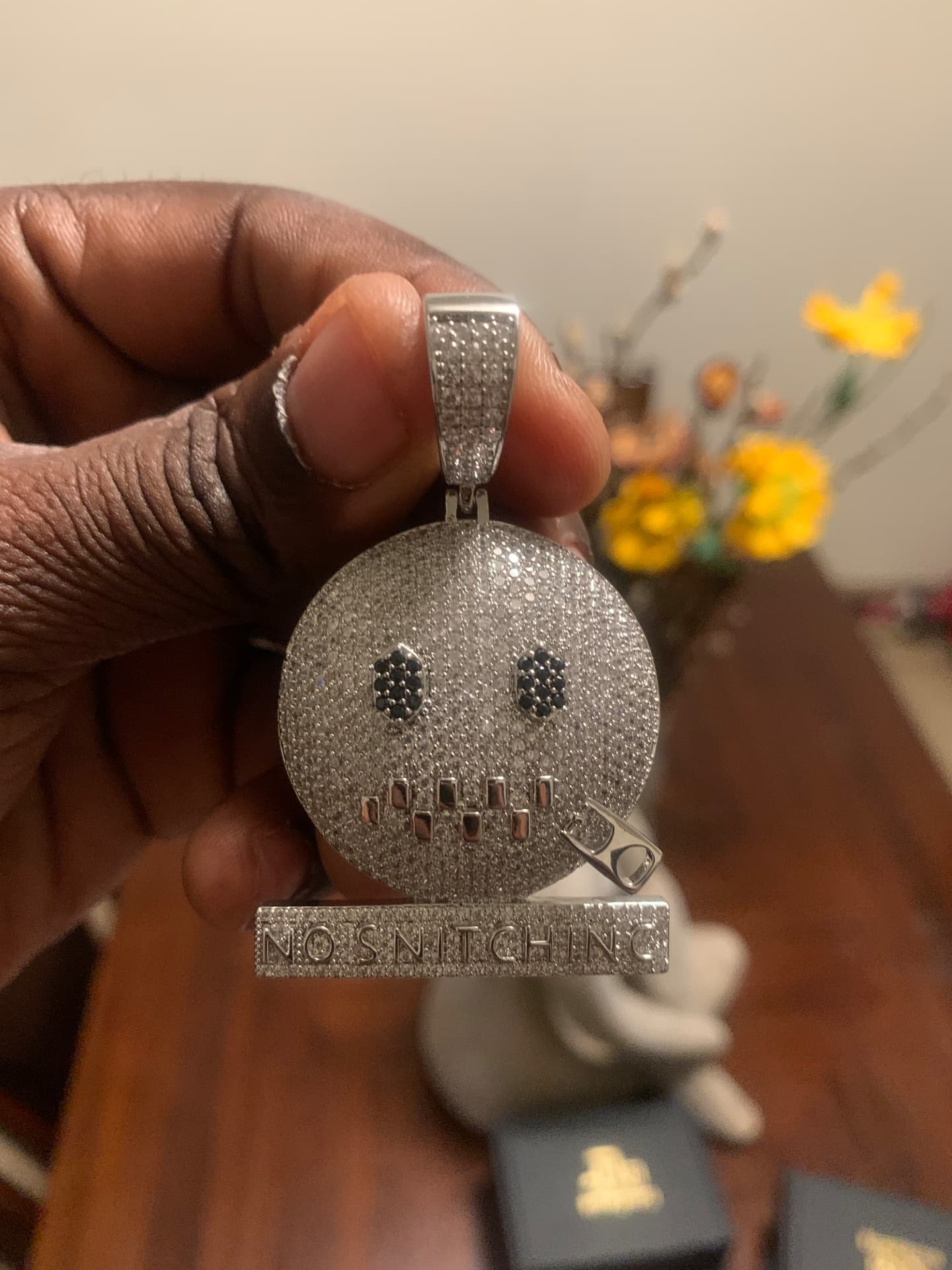 Close view of the No Snitching moissanite pendant