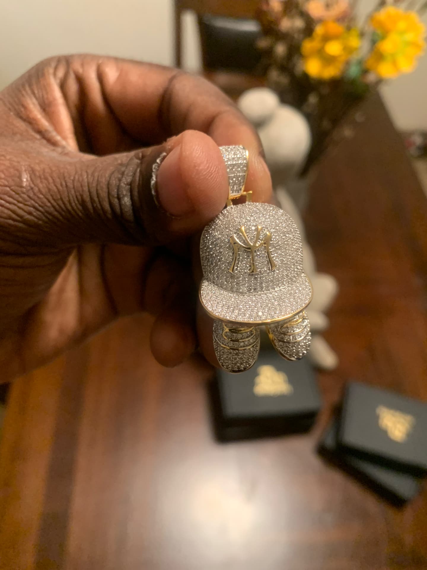 Silver NY cap pendant with iced sneakers