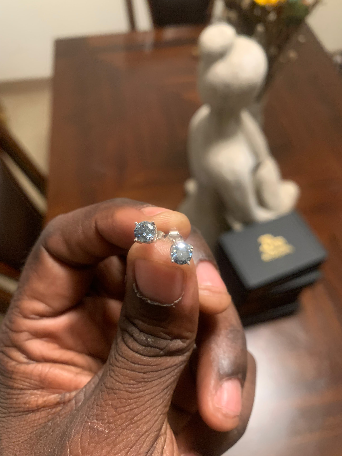 Alternate view of the round moissanite solitaire studs