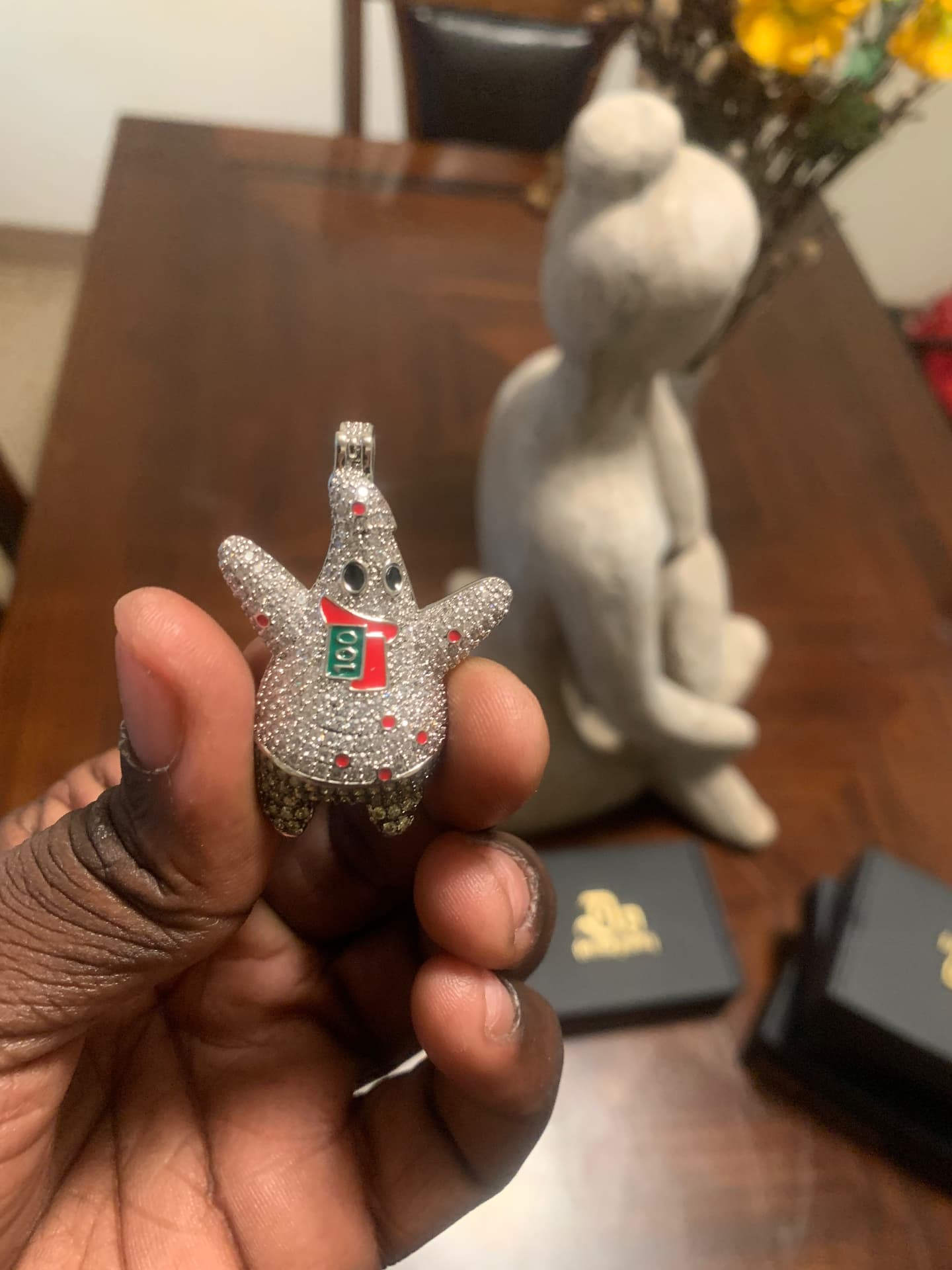Full view of the iced character pendant